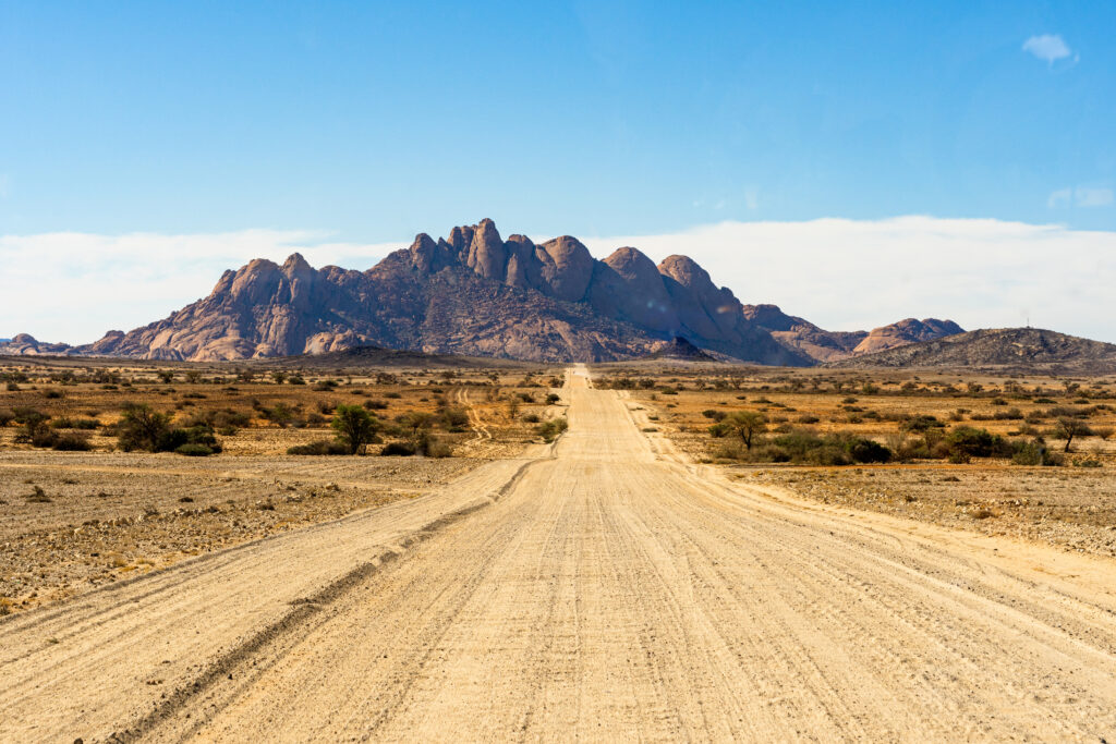 Road way to spitzkoppe mountains. The spitzkoppe, is a group of bald granite peaks located in swakopmund namib desert - namibia jcomp